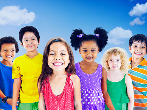 Children-Smiling-in-Front-of-Clouds